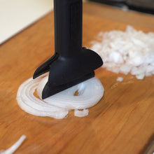 Load image into Gallery viewer, dbChopper kitchen gadget chopping sliced white onions on a wooden counter

