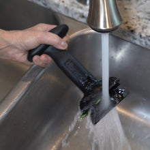 Load image into Gallery viewer, dbChopper being washed by hand in a kitchen sink under a running faucet
